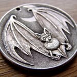 'Bat' carveing in a silver USA 1964 (Kennedy silver half $) 2
