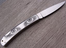 Bulino engraving on Stainless steel folding knife handle 1