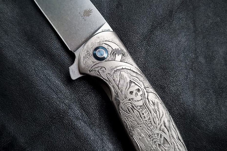 Hand engraved in a titanium Kizer Gemini knife handle.
